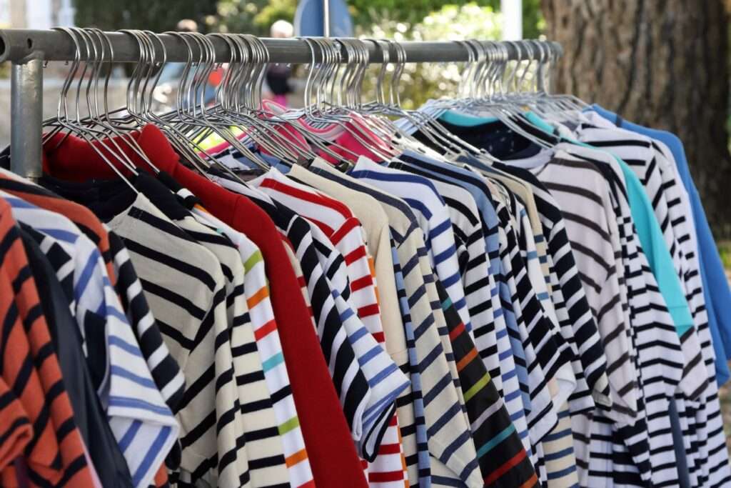 Rack of Breton style shirts at a French market