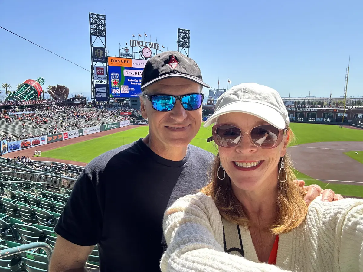 couple at Oracle Park for a San Francisco Giants baseball game