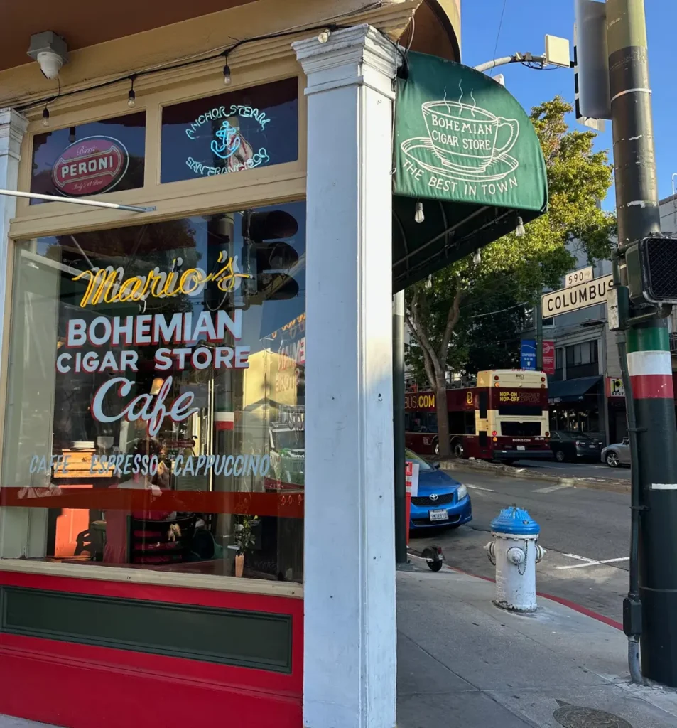 marios bohemian cigar store in north beach with green awnwing and street sigh