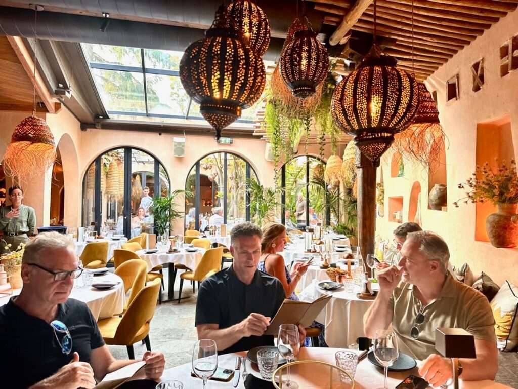 the dining room of salama in saint tropez with lanterns and diners