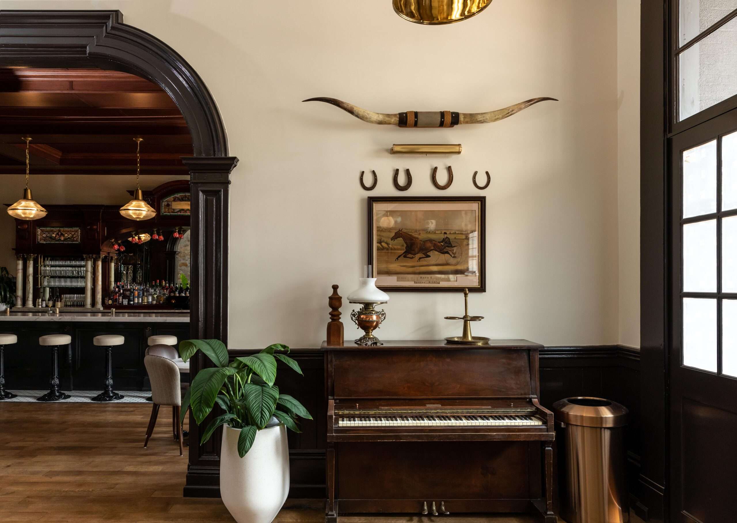 Lobby of the historic Holbrooke Hotel in Nevada City, California with piano and western decor