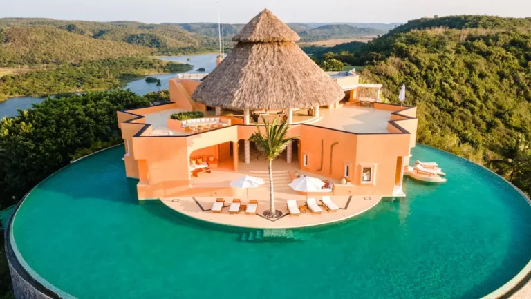 an aerieal view of a mexican villa with pool in careyes