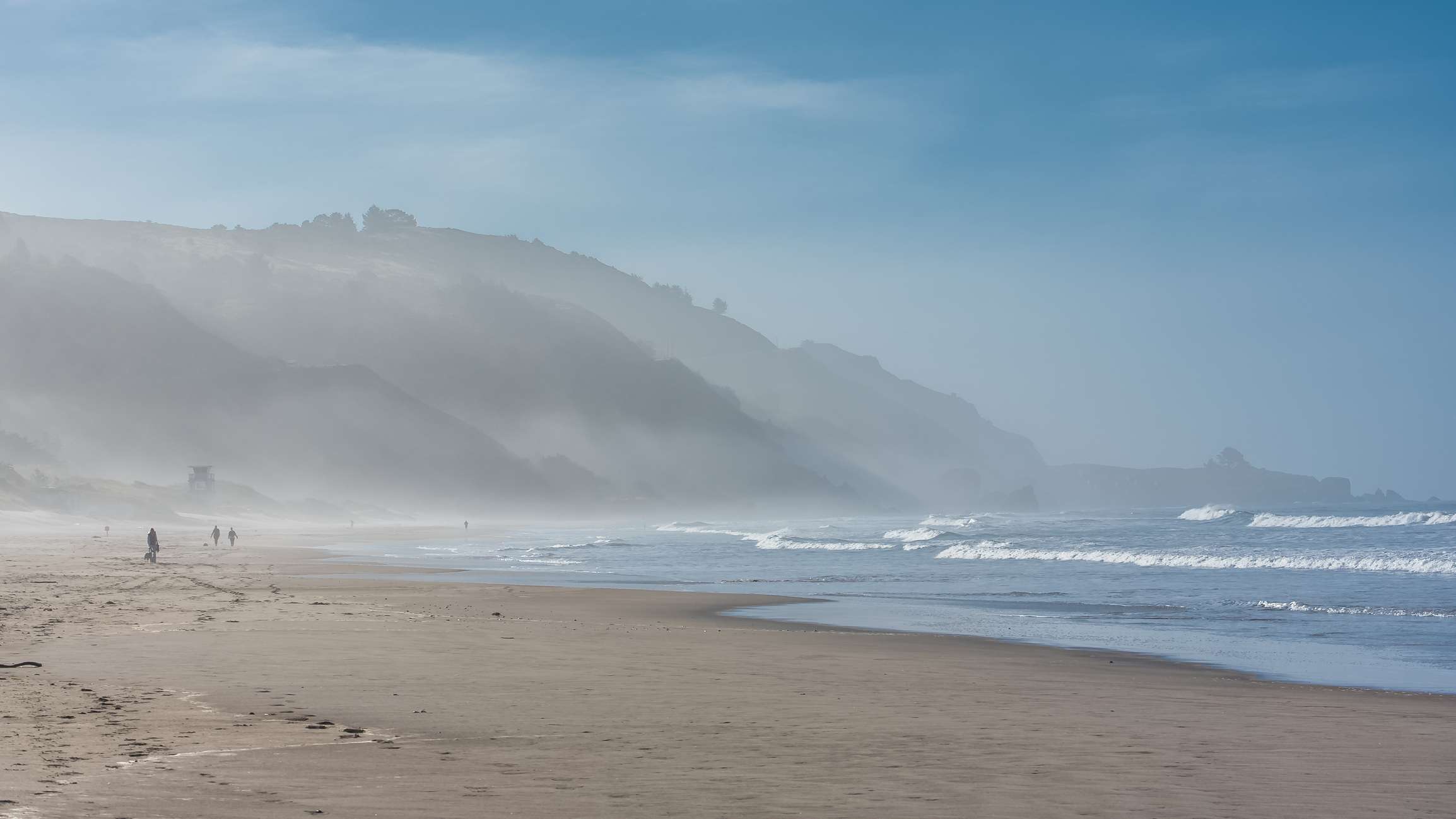 Sandy Stinson Beach on a misty morning with waves rolling in