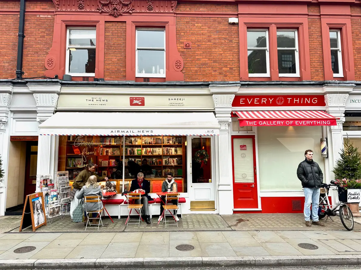 airmail cafe in london with out door tables and brick building