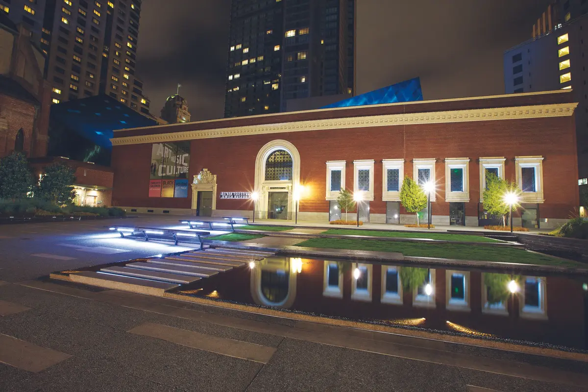 night view of the contemporary jewish museum in san francisco with water reflection