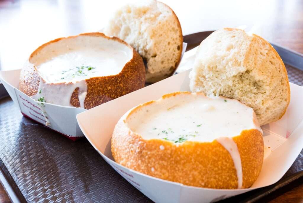 Sourdough bread bowls full of clam chowder