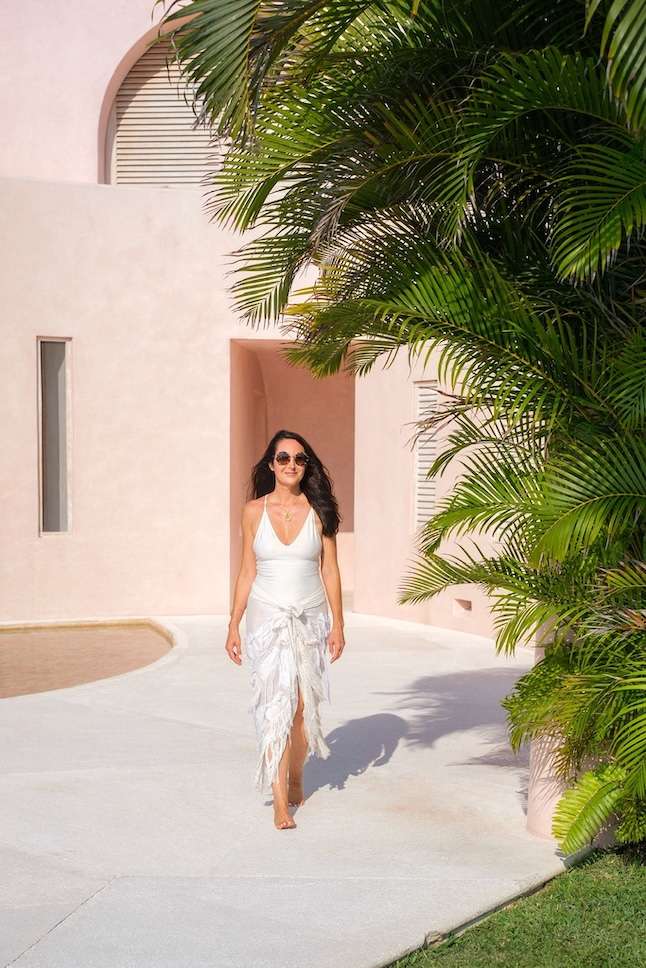 fashionable woman walking in swimsuit in Careyes, Mexico