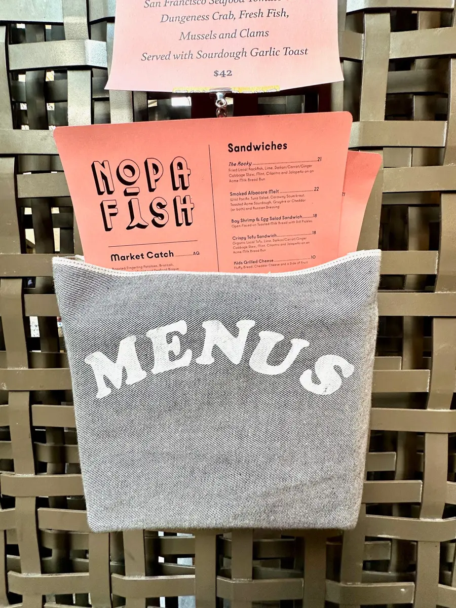 nopa fish ferry building menu in grey holder
