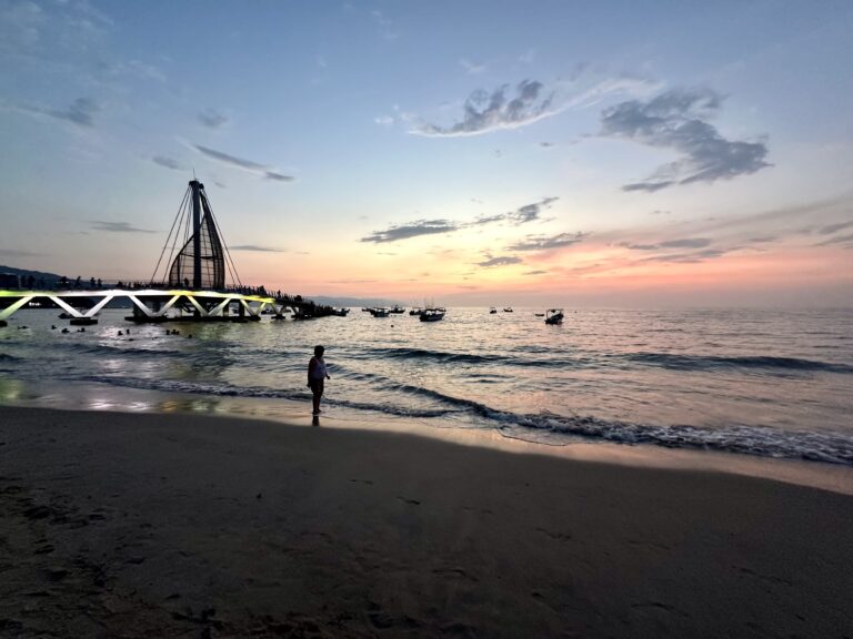 Sunset view of Puerto Vallarta beach and los muertos beach pier