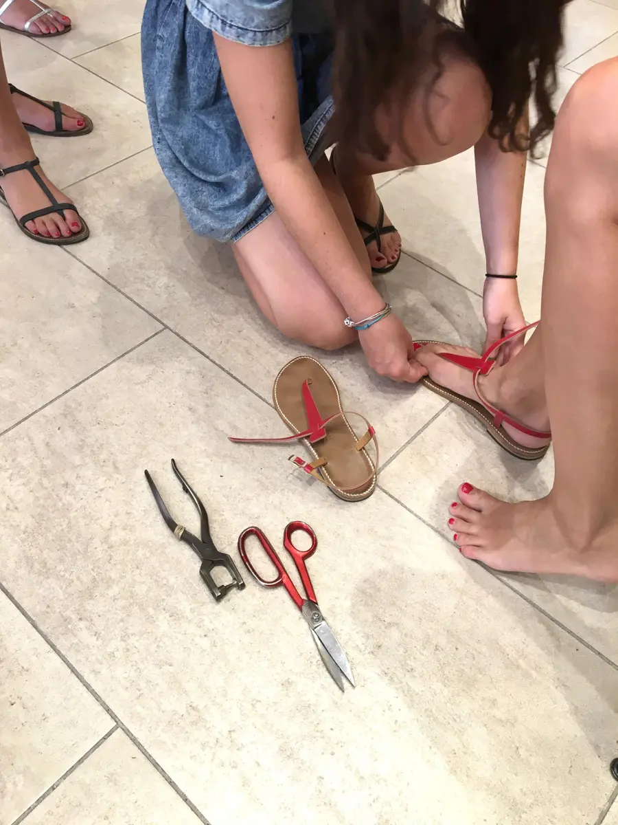 having sandals fitted to my foot at rondini in saint tropez