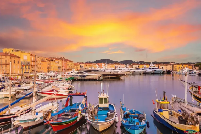 saint-tropez port at sunset with old boats and buildings