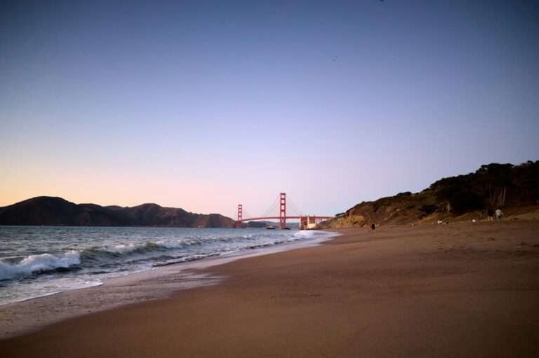 baker beach in san francisco with bridge in background is great to visit during summer season