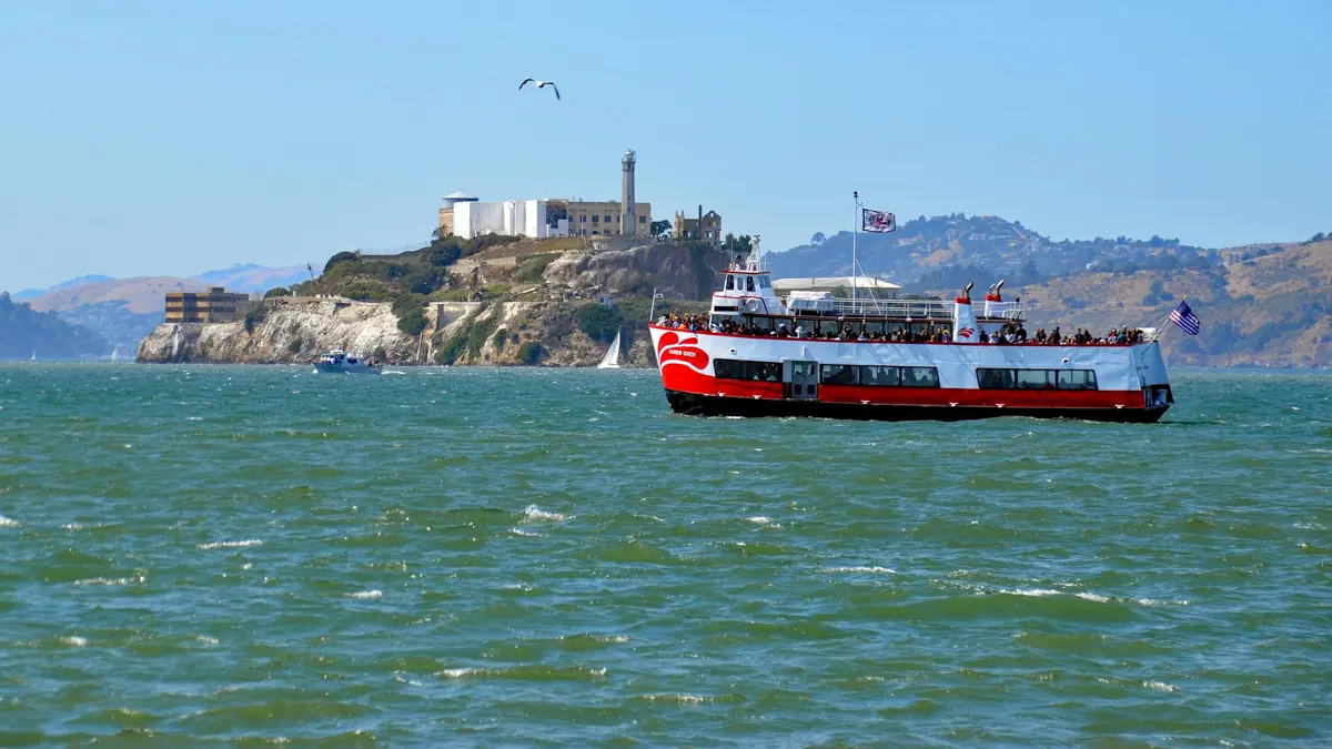sunny day with boat on the San Francisco Bay and alcatraz in the background