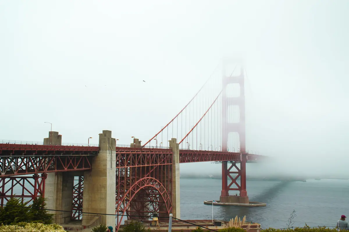 the golden gate bridge smothered in fog