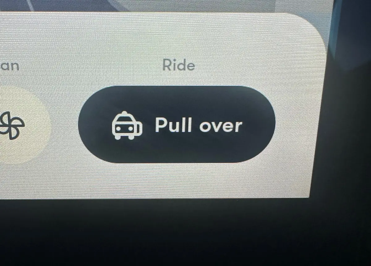 pull over button on screen inside the waymo driverless car in san francisco