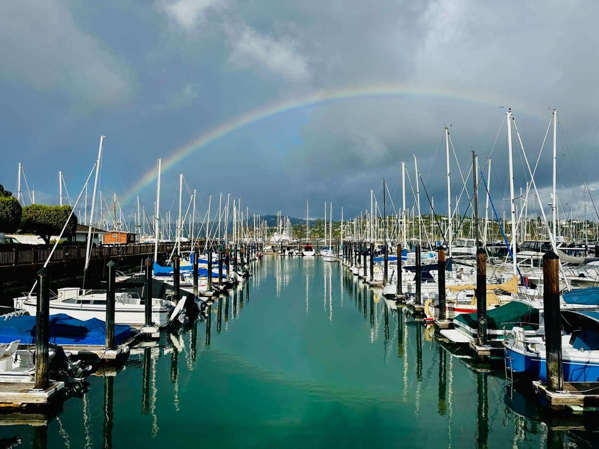 rainbow over a marina in sausalito