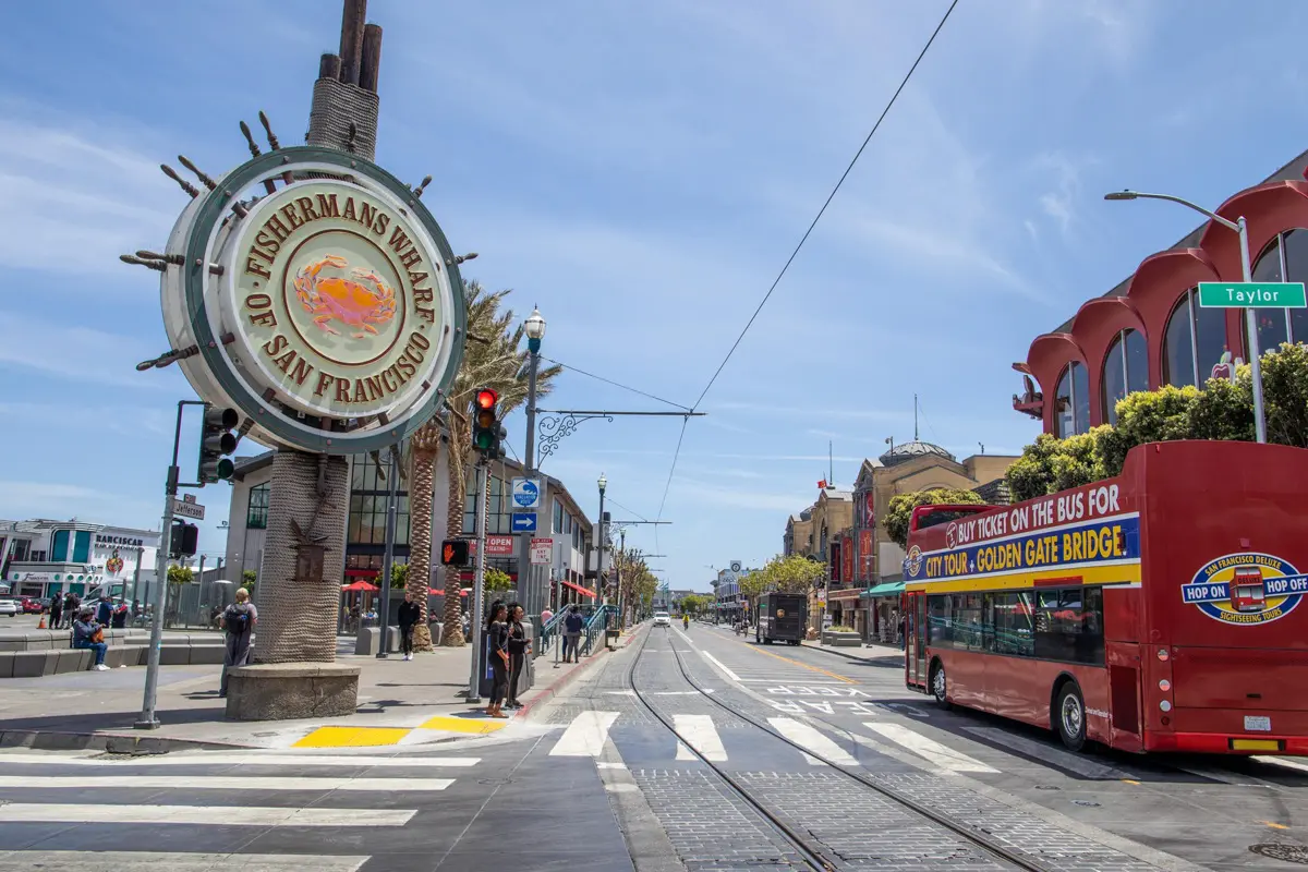 fisherman's wharf sign and tourist bus is one of the easiest areas for families and first time visitors to san francisco