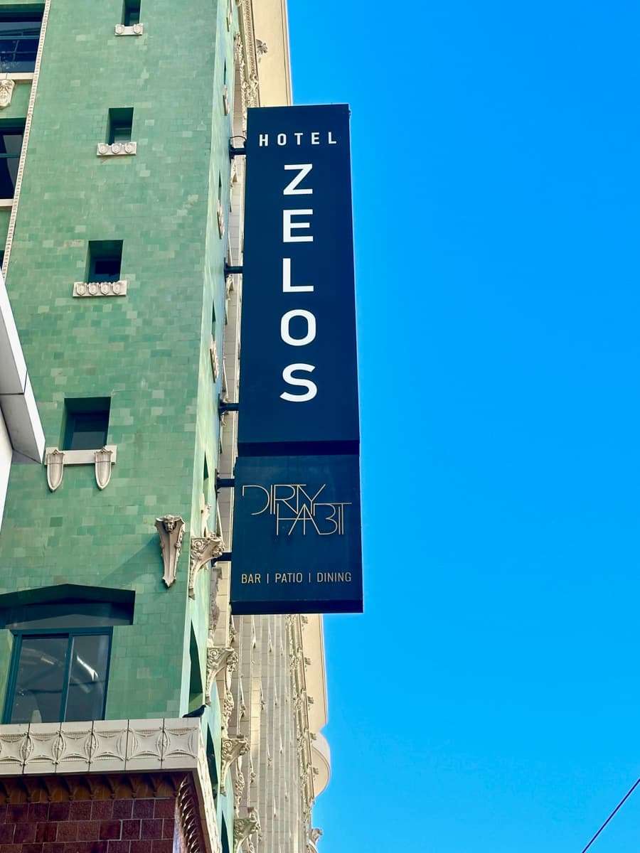 Hotel Zelos sign with green tiles of Pacific Building in San Francisco