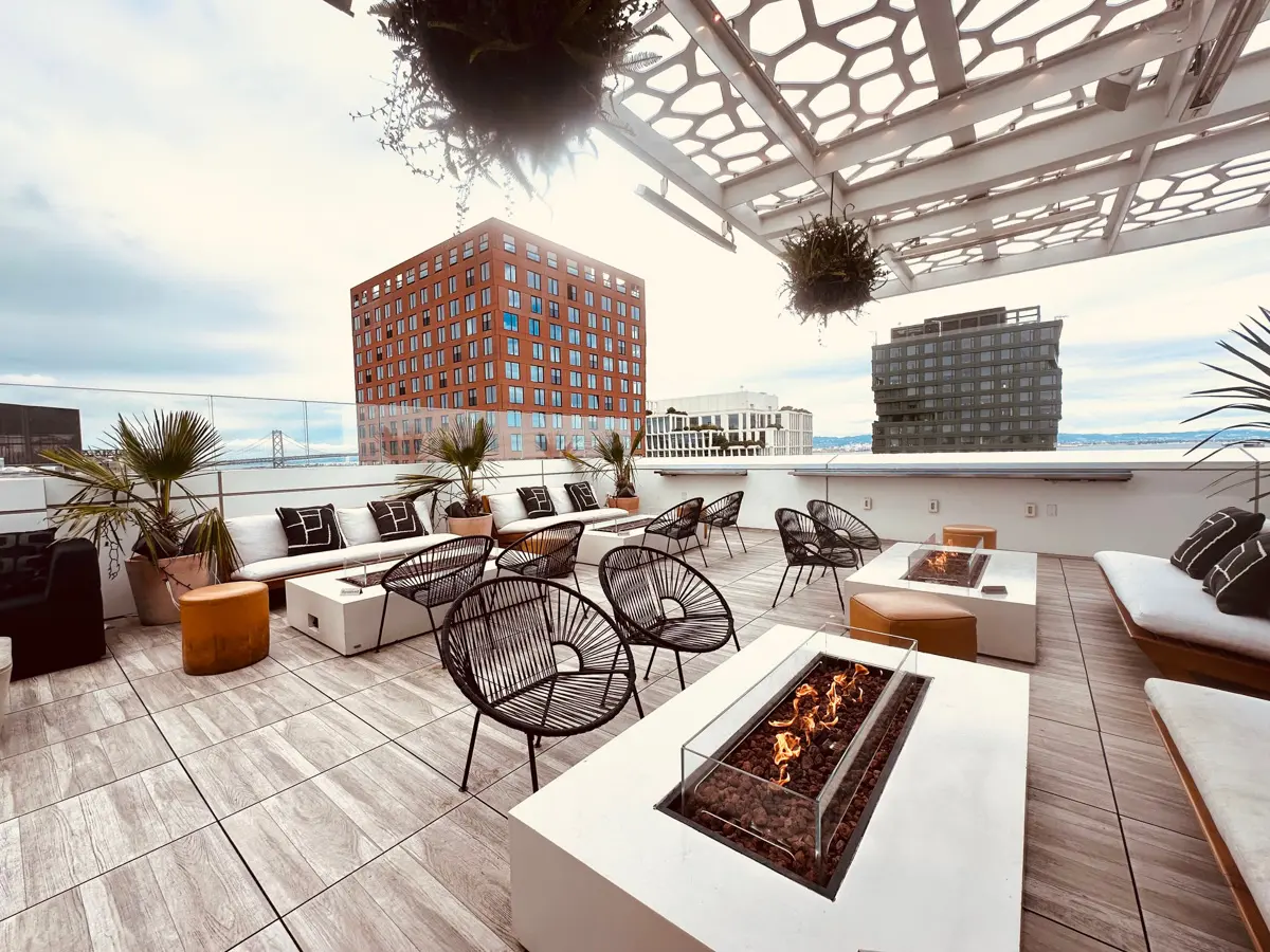 LUMA hotel roof bar with seating areas and views