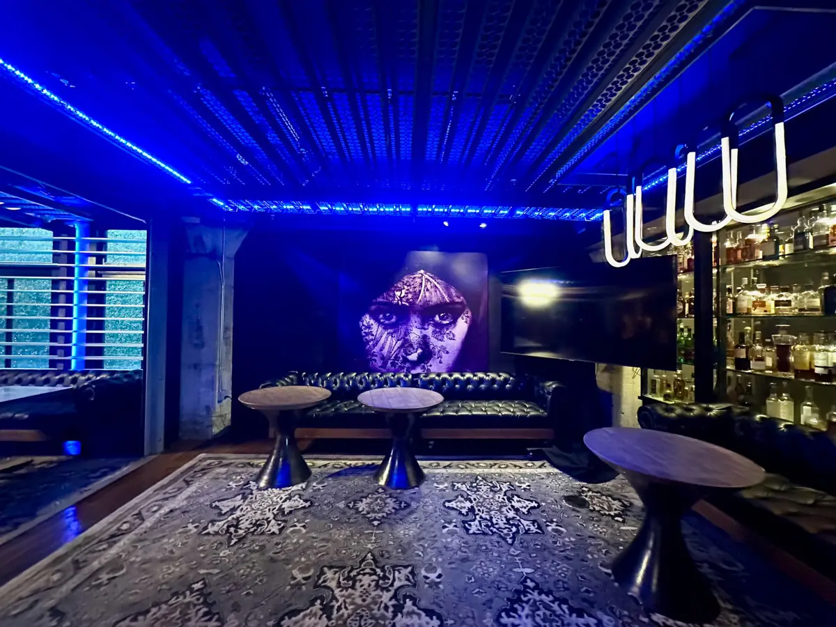 Hotel Zelos dirty habity wall art and whiskey cabinet