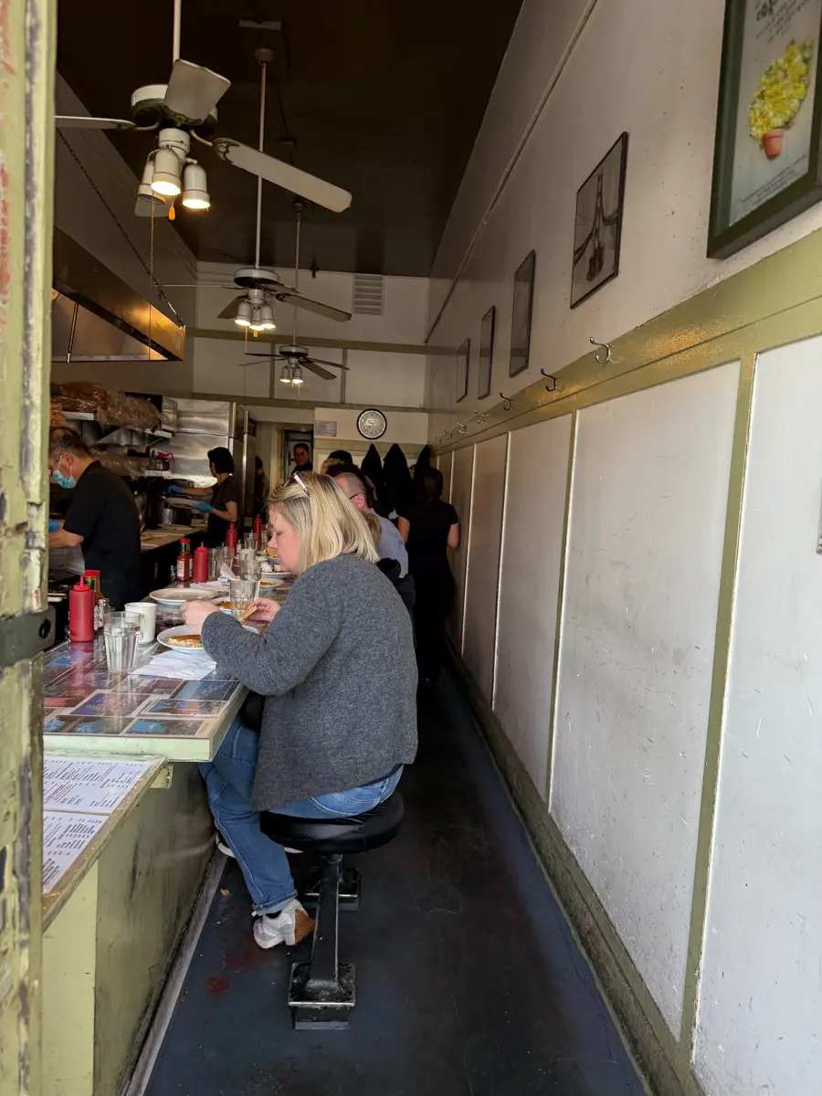 diners at stools of arts cafe on irving street
