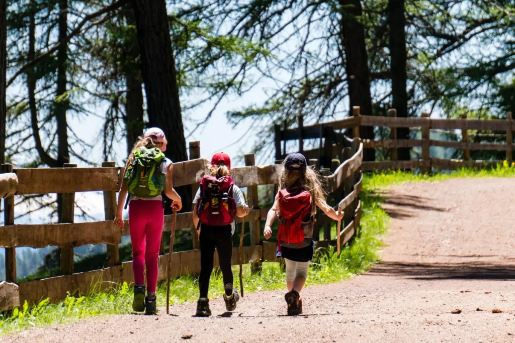 girls hiking with backpacks