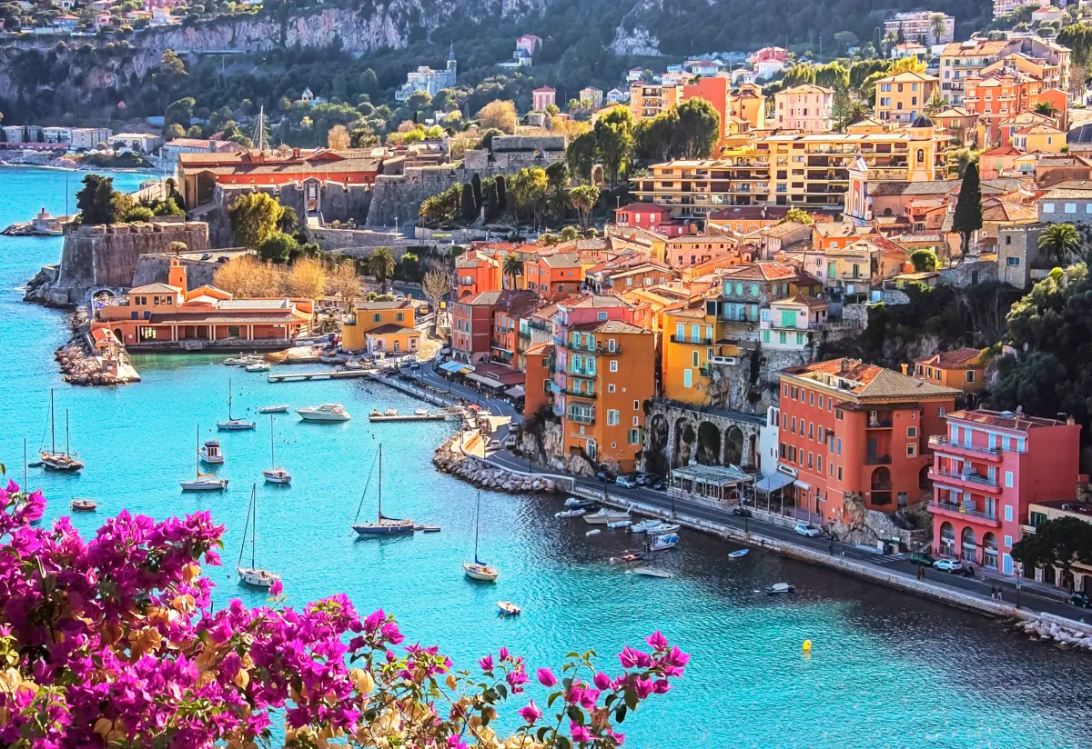 french riviera seaside village with colorful buildings and harbor