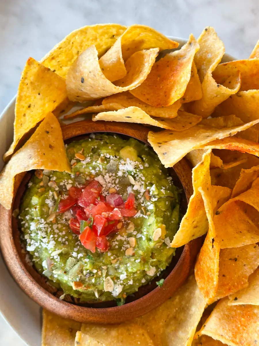 guacamole inner sunset with chips and red tomatoes