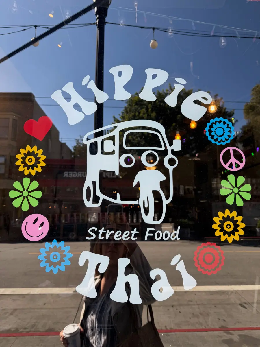 hippie thai restaurant window with flowers