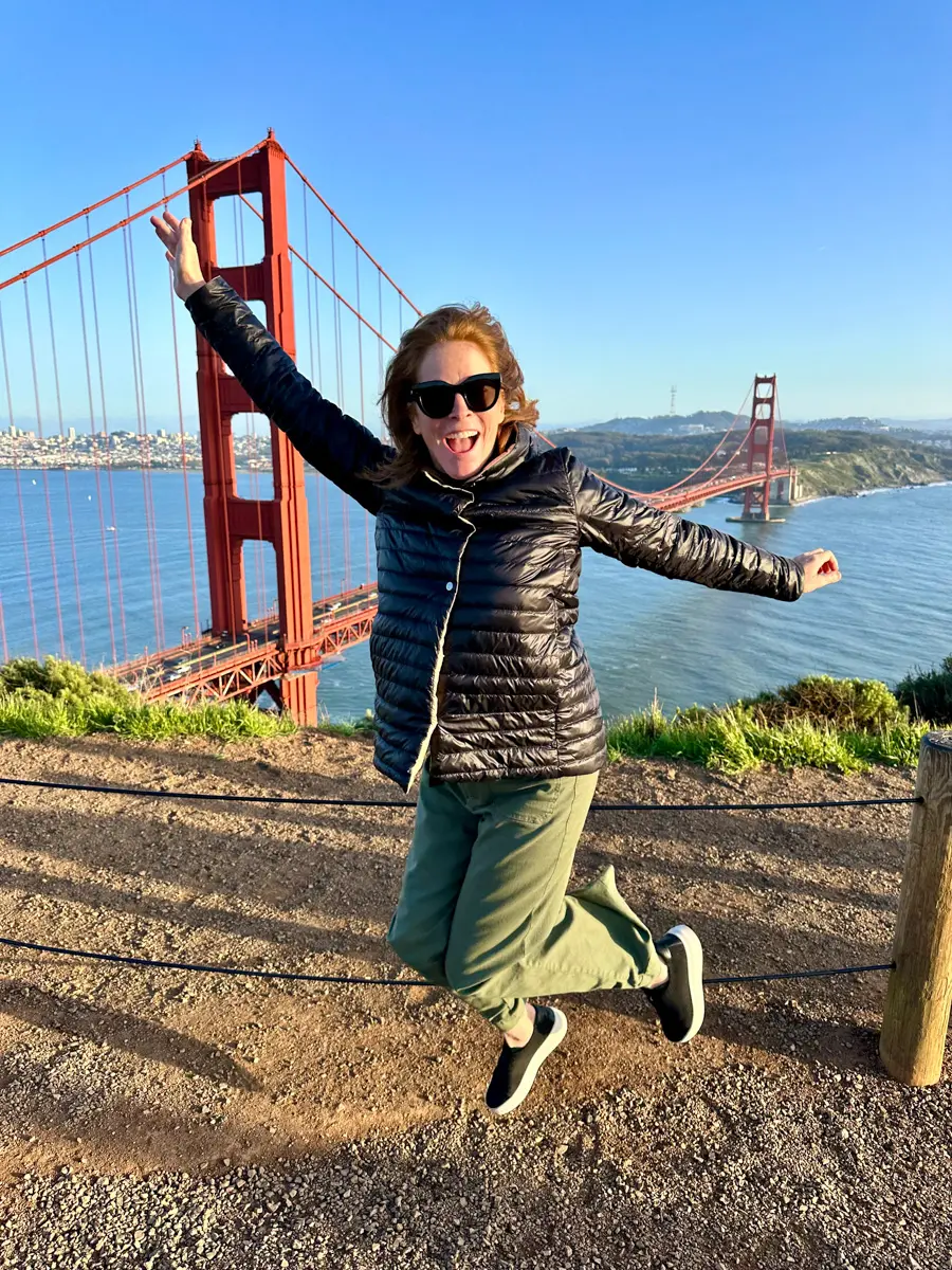 jumping in front of the golden gate bridge in San Francisco