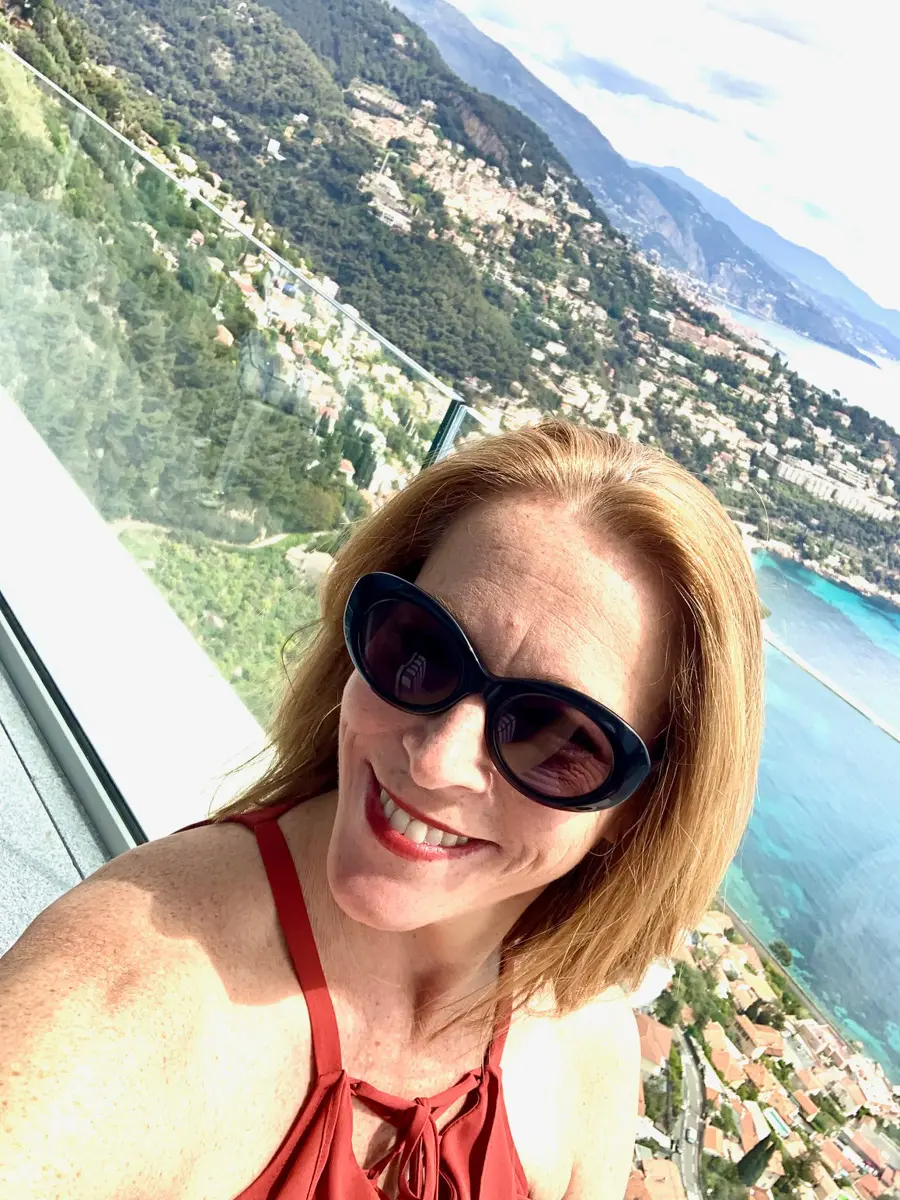 woman with french riviera in background