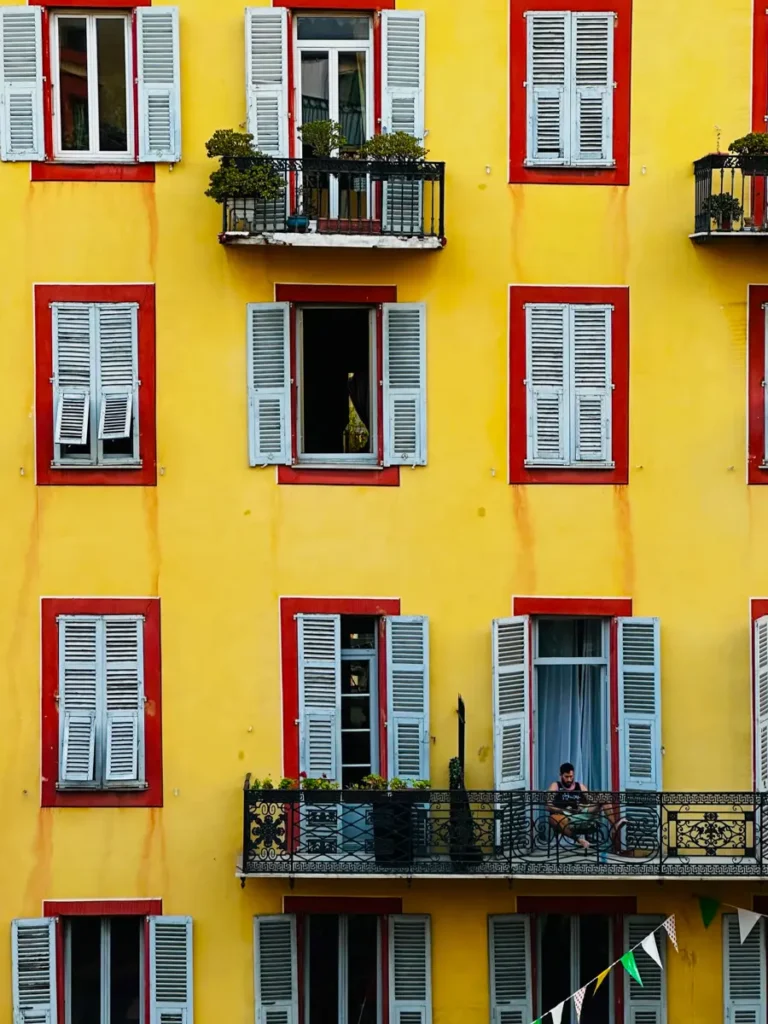 front of building in Nice, France, French Riviera with balconies and shutters