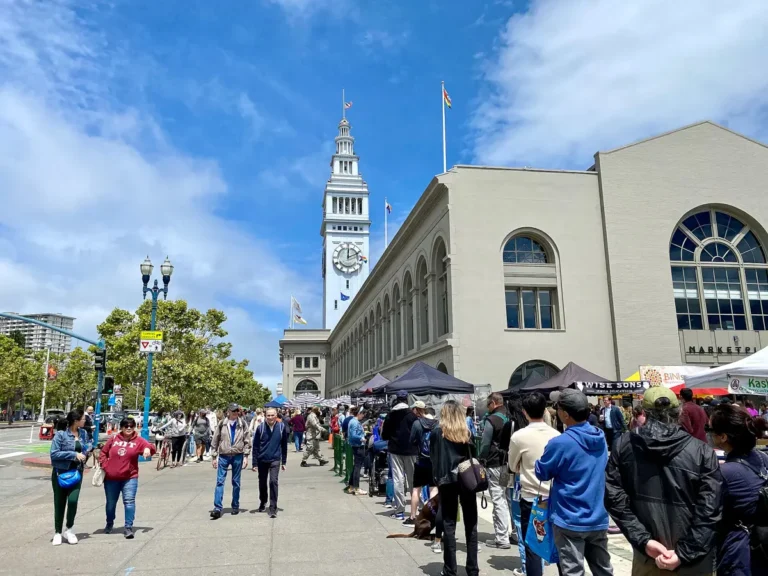 ferry building with people lined up outside