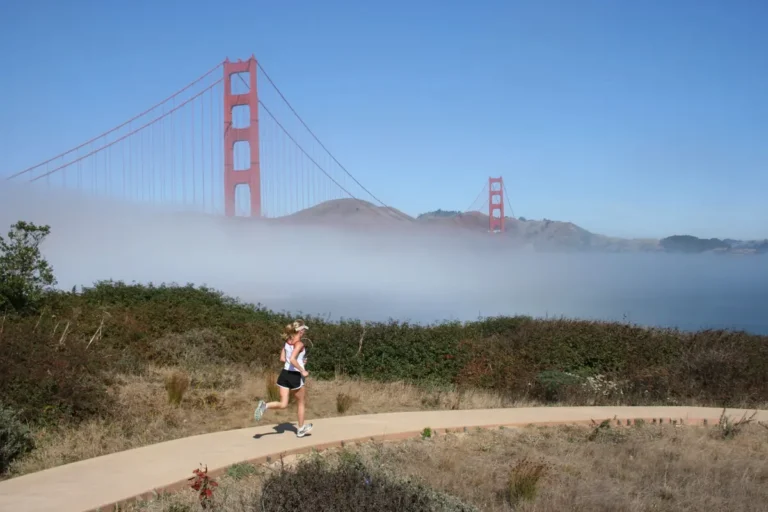 jogger at golden gate bridge with fog
