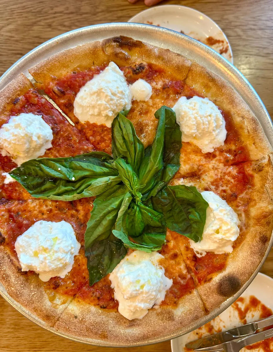a margherita pizza with fresh basil in North Beach