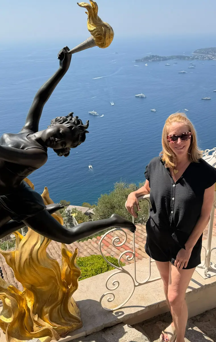 woman and statue in eze village french riviera