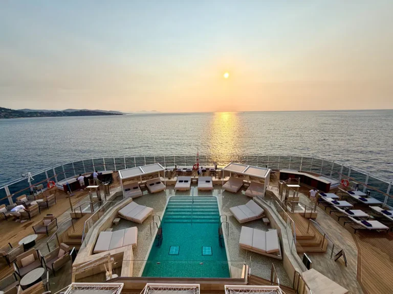 view of one of Explora III's pools with sunset