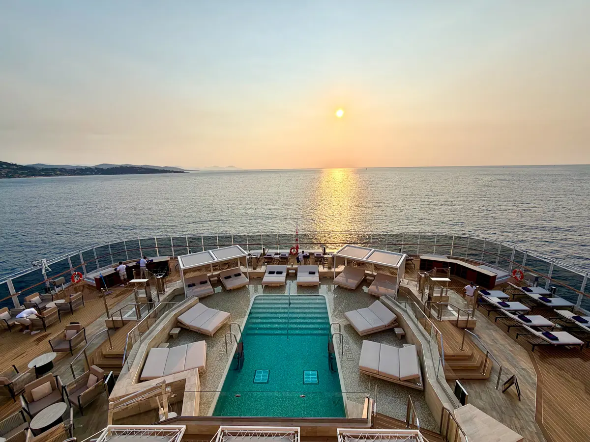 view of one of Explora III's pools with sunset