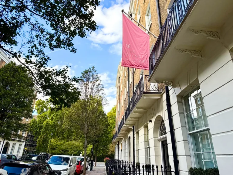 Prince Akatoki Hotel London exterior with trees and flag