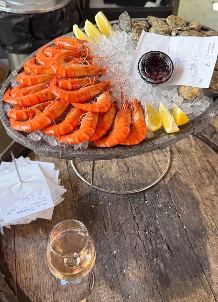 seafood platter with shrimp, ice, clams, and lemons at chez madeleine in saint tropez
