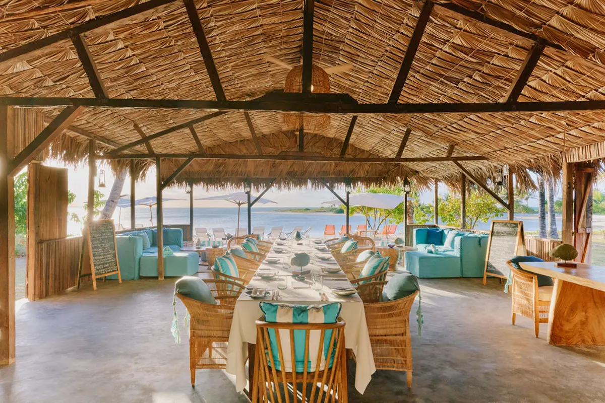 Crab Shack Miavana dining room with water views and thatched roof