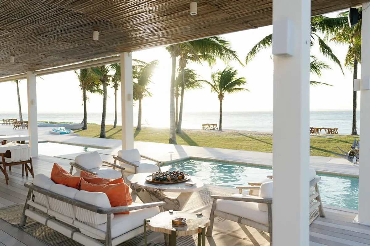 villa with private pool deck and seating at Miavana by Time + Tide Phto by Oliver Fly Photography